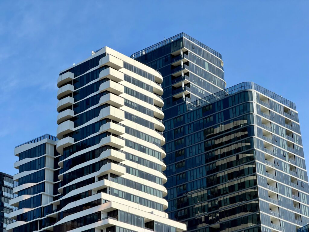Contemporary high-rise buildings in Box Hill, Victoria under clear blue sky.